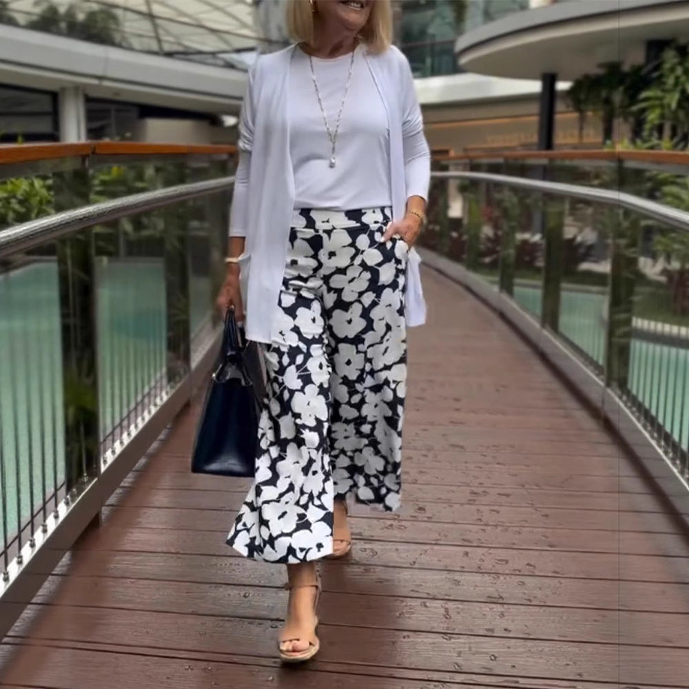 Women's wide Palazzo pants with large floral print, high waistband and side pockets Mune Fashion