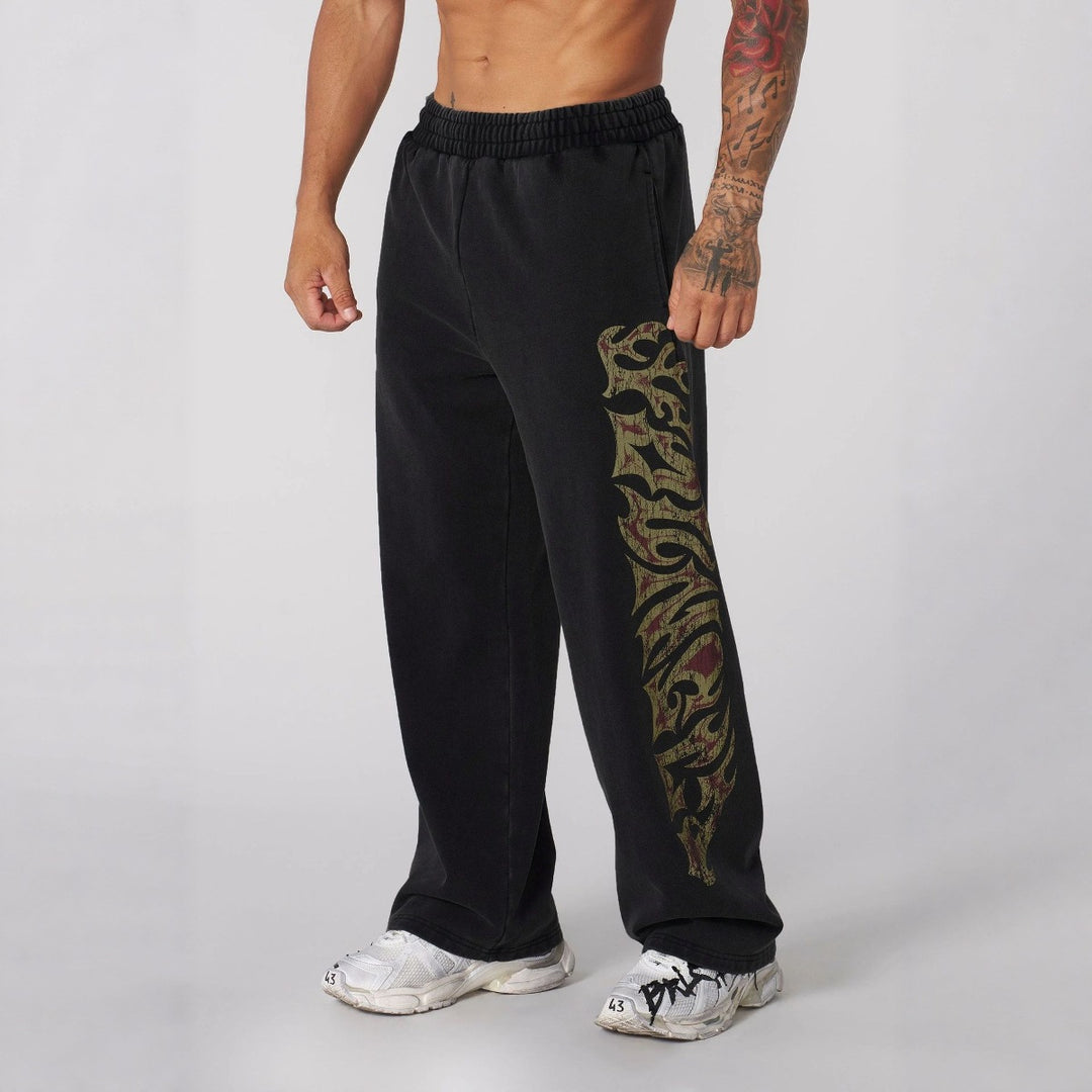 Men's baggy joggers with elastic waistband, side pockets and detailed skull and rose motif Mune Fashion