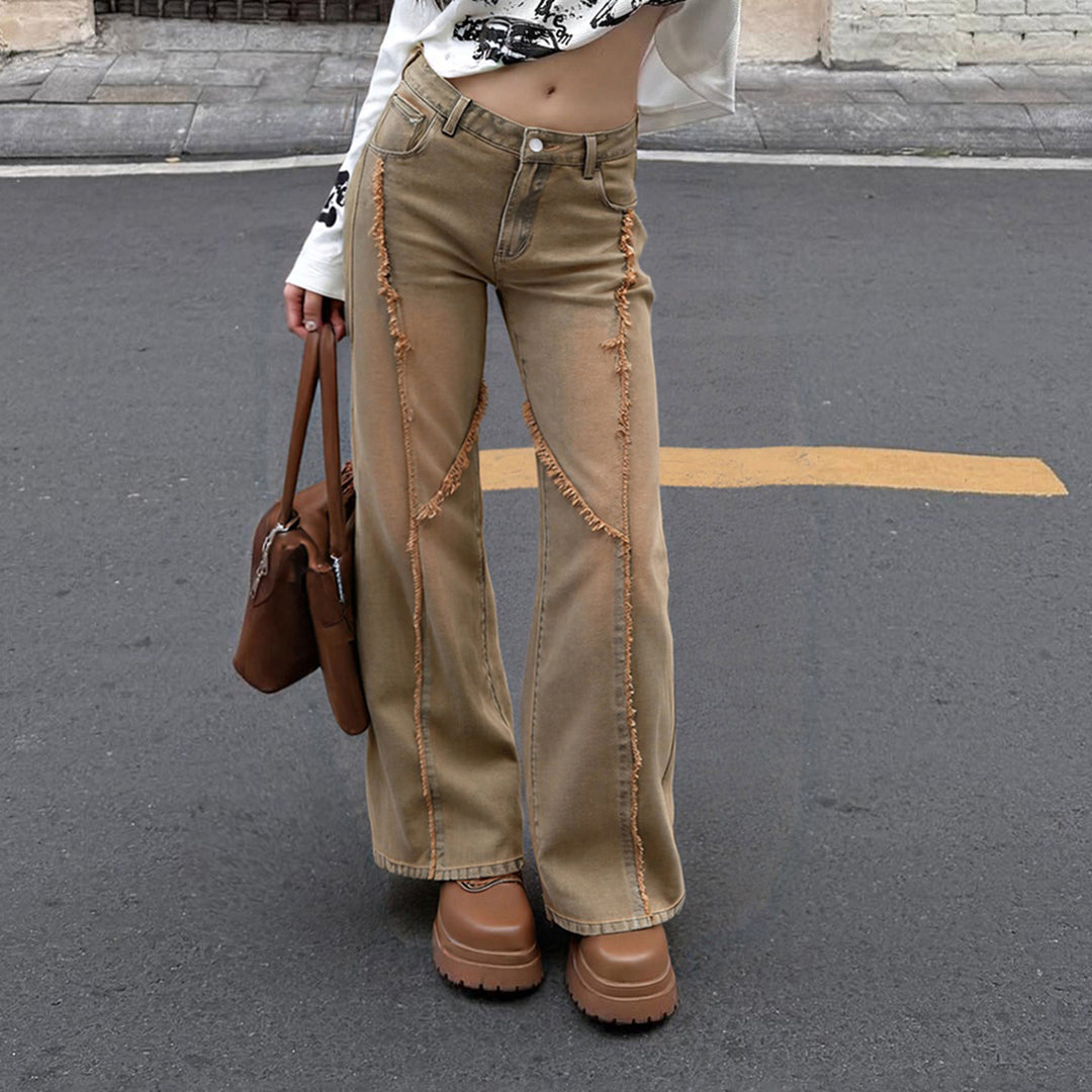 Women's high-waisted wide-leg jeans with raw hem seams, diagonal fringe trim, and relaxed fit Mune Fashion