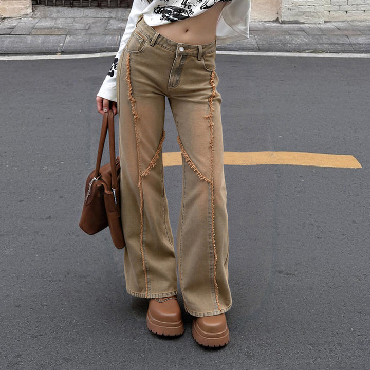 Women's high-waisted wide-leg jeans with raw hem seams, diagonal fringe trim, and relaxed fit Mune Fashion