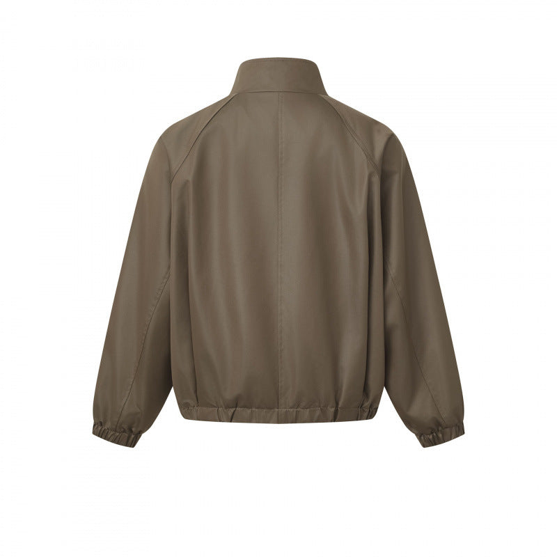 Men's short cut faux leather bomber jacket with stand-up collar, raglan sleeves, and elastic hem Mune Fashion