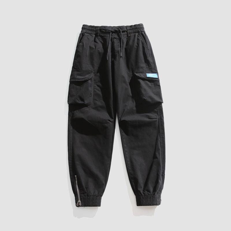 Herren Konisch geschnittene Utility-Cargo-Jogginghose mit Tunnelzugbund, Klapptaschen und Knöchelreißverschlüssen Mune Fashion
