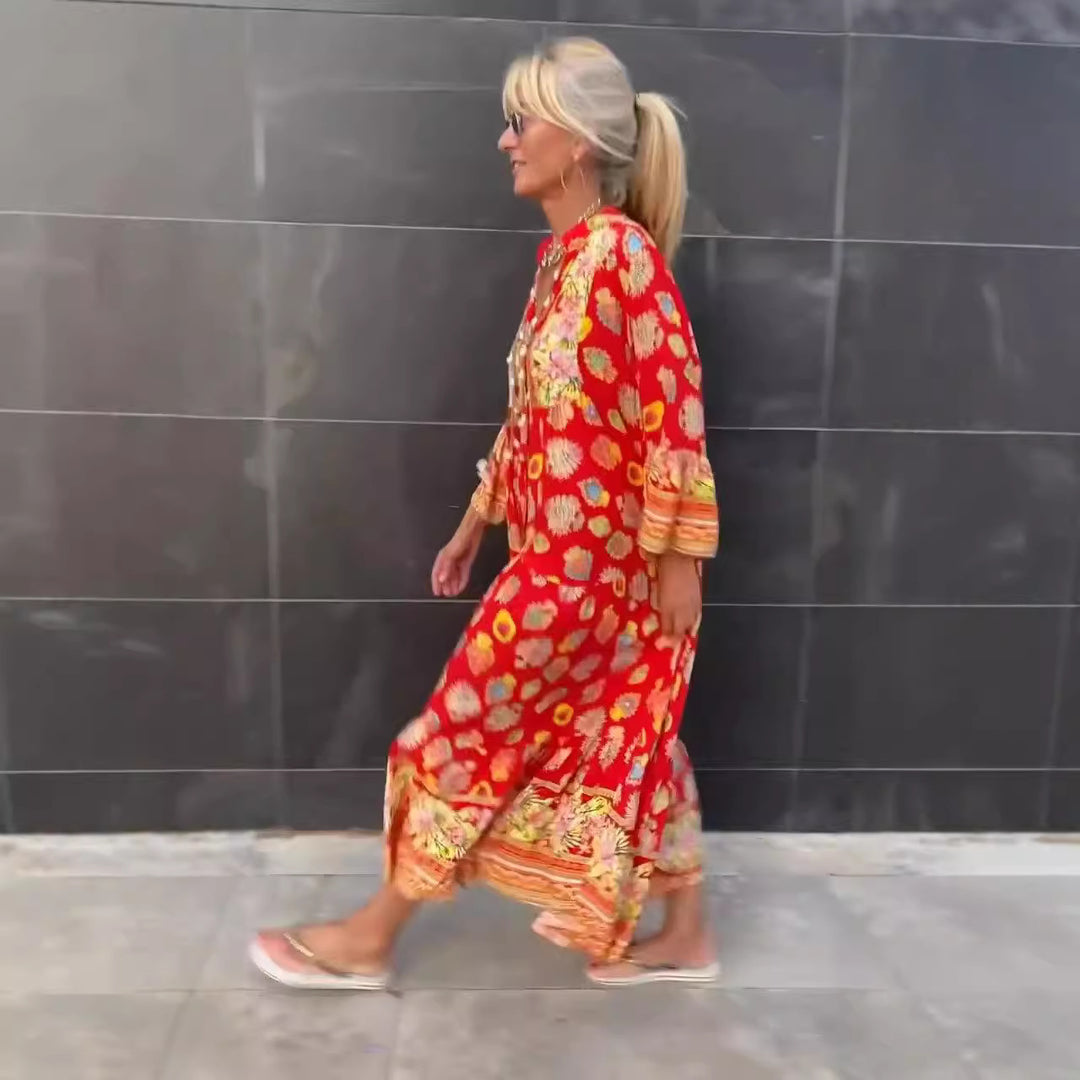Women's airy kaftan midi dress with folk-inspired border print, V-neckline, tassel ties, and flounce bell sleeves Mune Fashion
