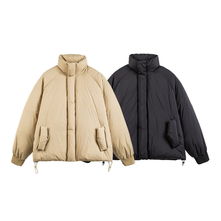 Unisex Boxy-padded short jacket with high stand-up collar, raglan sleeves and drawstring hem Mune Fashion