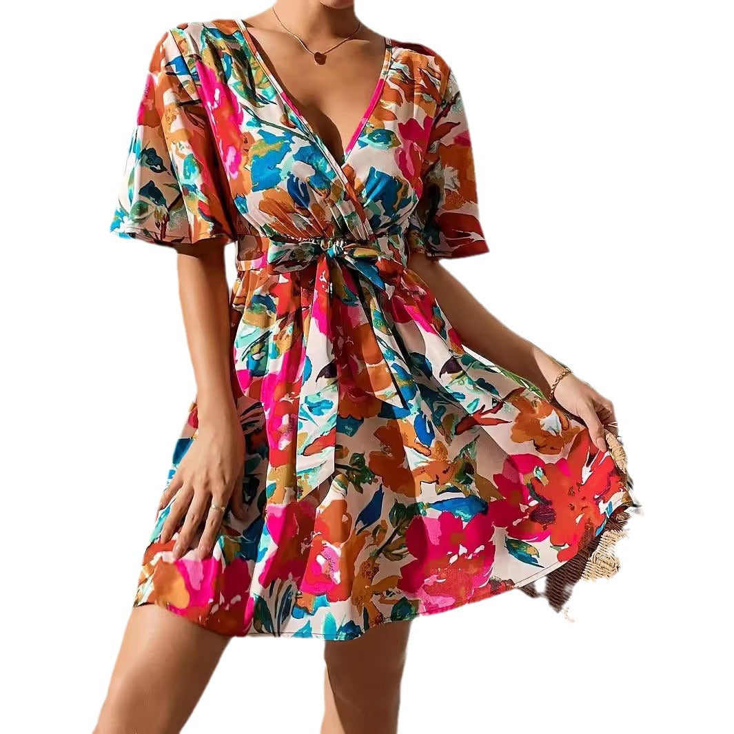 Women's wrap mini dress with deep V-neck, waist lacing, and wide trumpet sleeves Mune Fashion