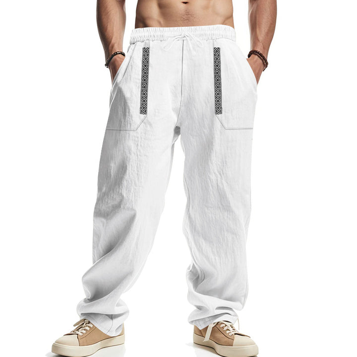 Men's loose-fitting casual pants made of linen blend with elastic waistband, deep side pockets, and ethnic decorative band Mune Fashion