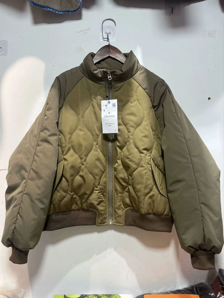 Women's quilted bomber jacket with high stand-up collar, lightweight thermal padding, and ribbed cuffs Mune Fashion