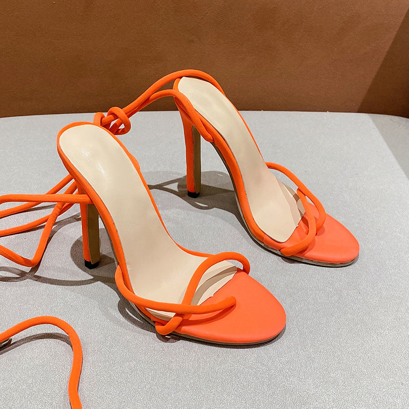 Women's ankle strap sandals with twisted lace straps, slim stiletto heel, and padded comfort footbed Mune Fashion