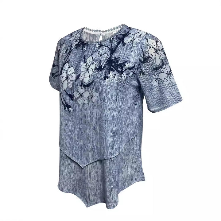 Women's two-layer blouse dress with asymmetrical tiered hem, floral print yoke, and wing sleeves Mune Fashion