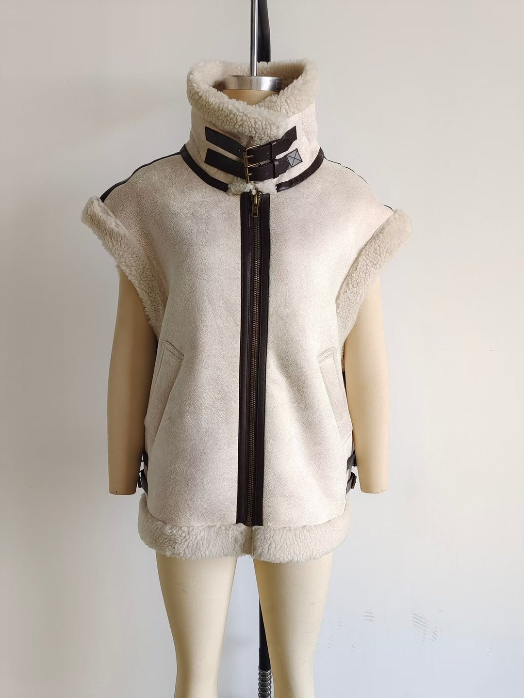 Women's padded lambskin look vest with stand-up collar, zipper and side buckle straps Mune Fashion