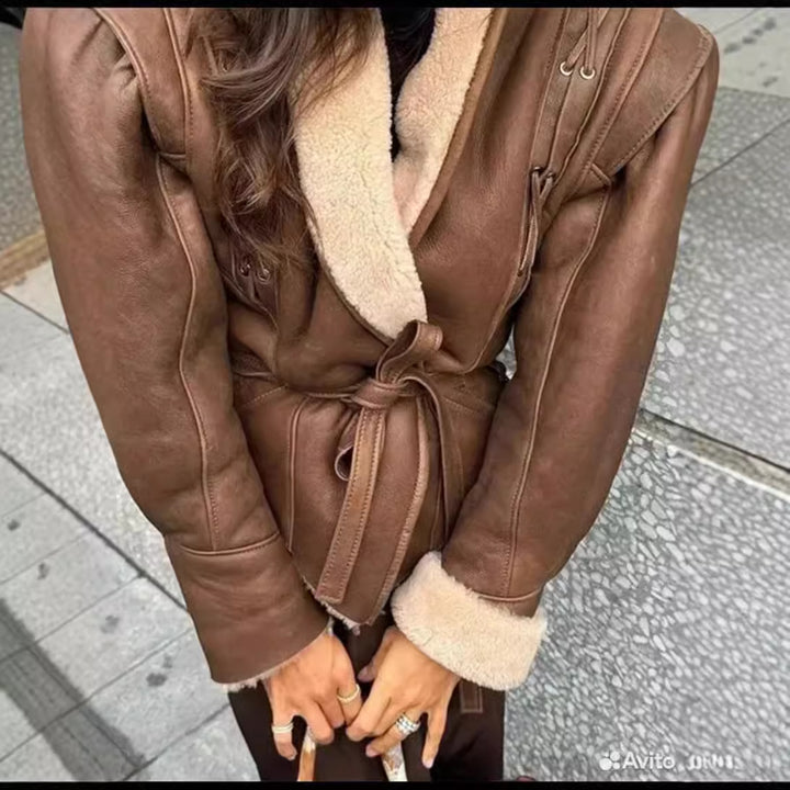 Women's tailored faux leather jacket with Sherpa lining, wrap belt, and side lacing details Mune Fashion