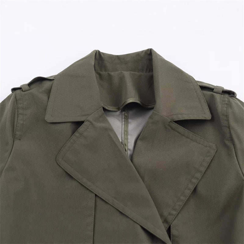 Women's short trench coat with A-line silhouette, double-breasted button placket, detachable belt, and shoulder epaulettes Mune Fashion