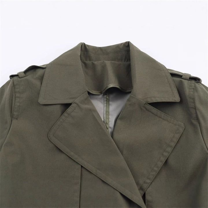 Women's short trench coat with A-line silhouette, double-breasted button placket, detachable belt, and shoulder epaulettes Mune Fashion