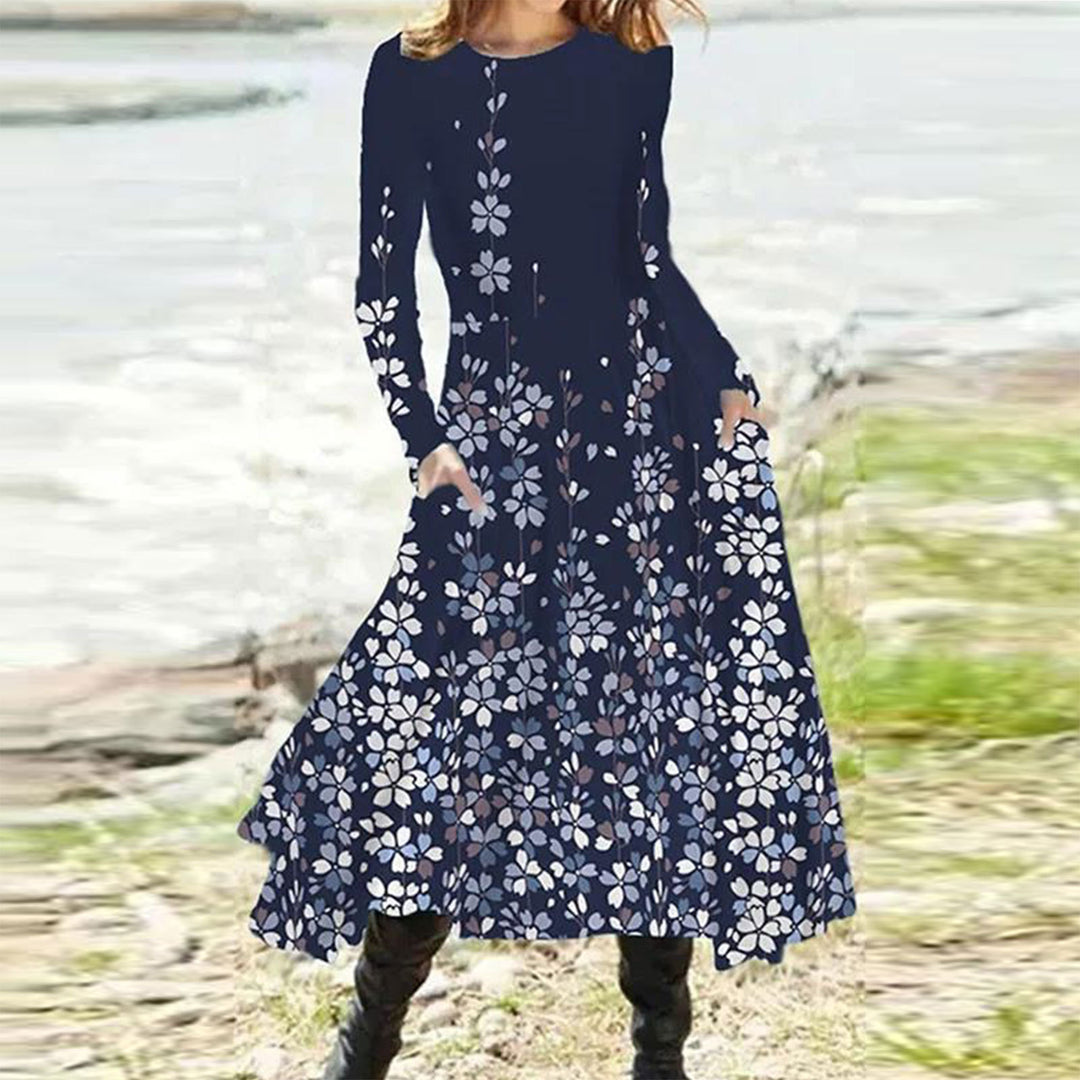 Women's flowing maxi dress with tie-dye circle pattern, round neckline, waist seam, and side pockets Mune Fashion