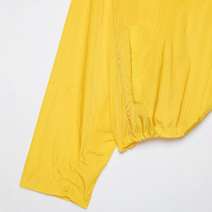 Women's lightweight cropped windbreaker with high stand-up collar and drawstring.