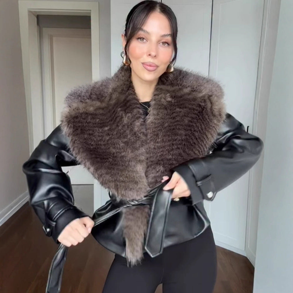 Women's short jacket in biker blouson style made of imitation leather with voluminous faux fur shawl collar and waist belt Mune Fashion