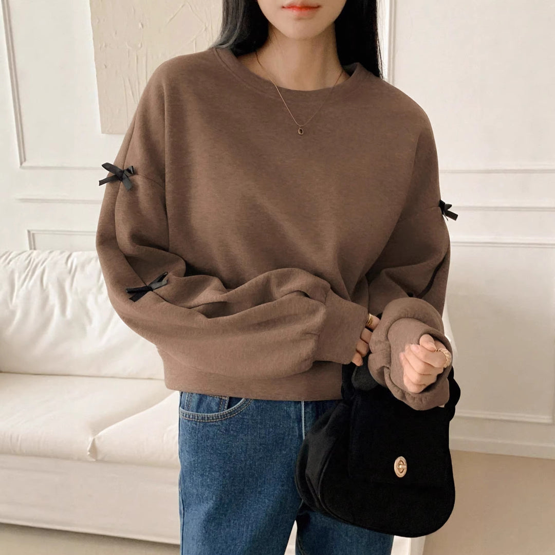 Women’s Oversize Sweatshirt with Decorative Bow Sleeves and Round Neckline Mune Fashion