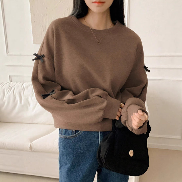 Women’s Oversize Sweatshirt with Decorative Bow Sleeves and Round Neckline Mune Fashion