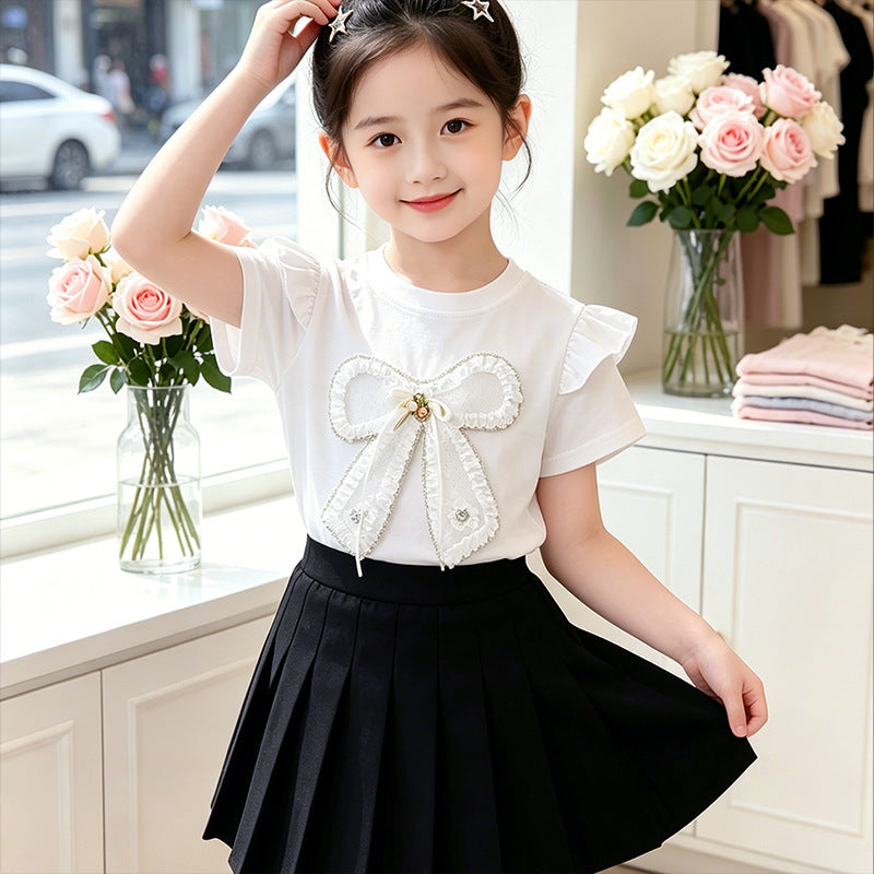 Girl's T-shirt with romantic bow motif and ruffle details Mune Fashion