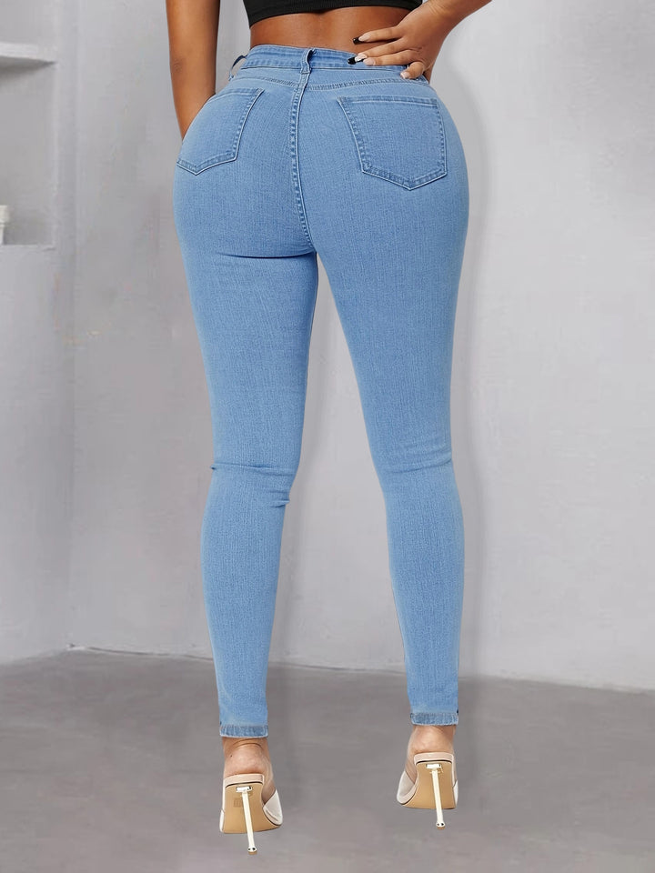 Women pearl-embellished high-waist skinny jeans with knee cutouts Mune Fashion