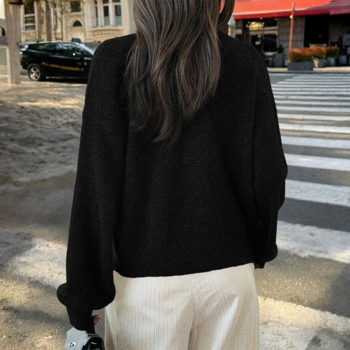 Women's cozy oversized knitted cardigan with horn button placket and round neckline Mune Fashion