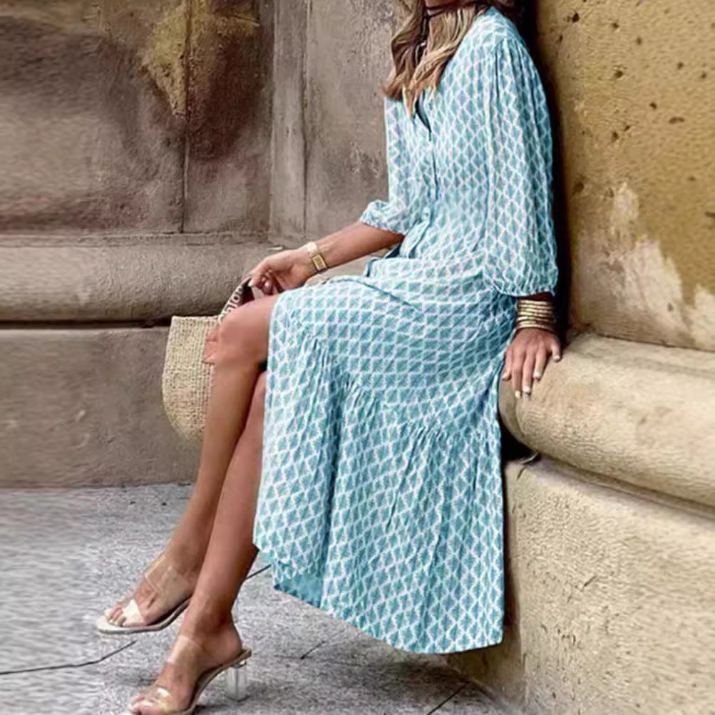 Women's lightweight patterned midi dress with V-neck, button placket, tiered skirt, and balloon sleeves Mune Fashion