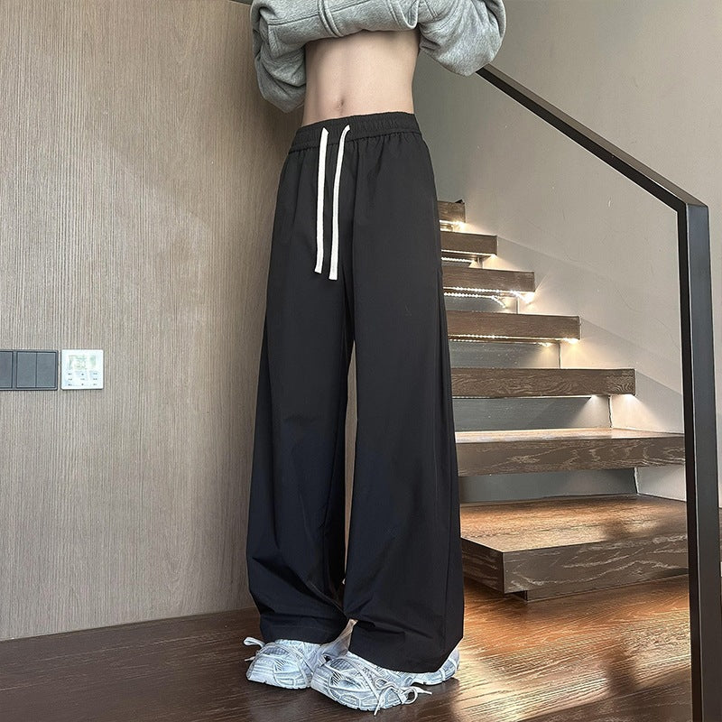Women's wide-cut lounge pants with high elastic waistband and drawstring Mune Fashion