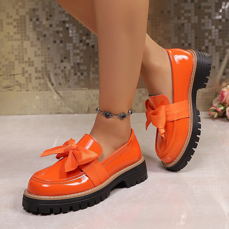Ladies patent look loafer with massive profile sole and large fabric bow Mune Fashion