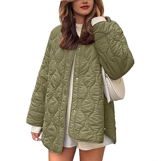 Women's quilted jacket in oversized design with curved quilting and side slit Mune Fashion