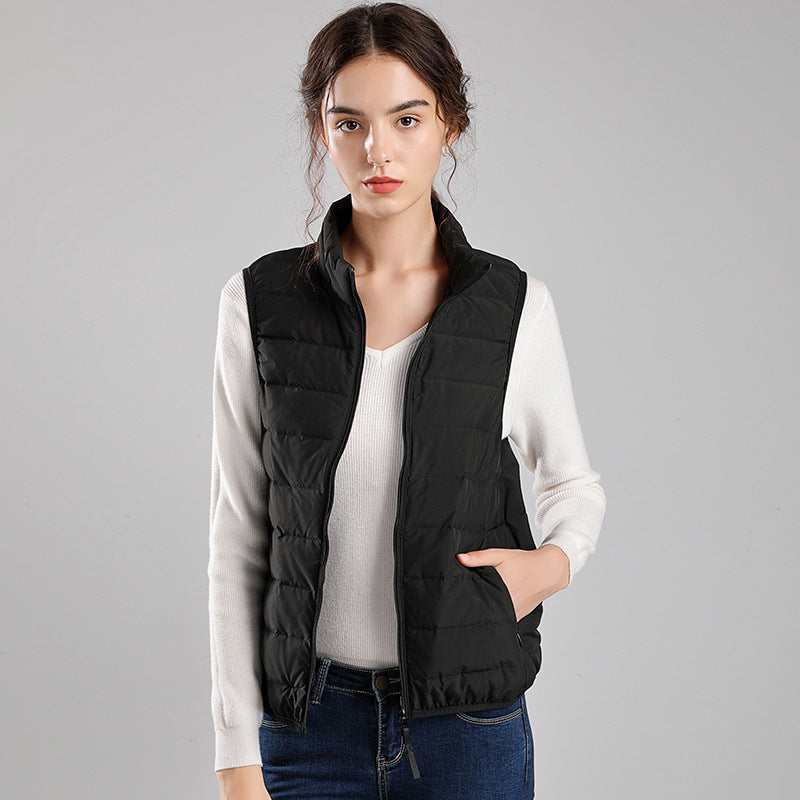 Women's packable quilted vest with flat down look, stand-up collar and side slip pockets Mune Fashion