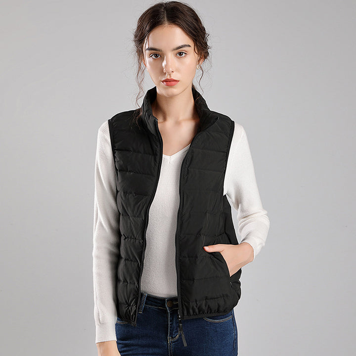 Women's packable quilted vest with flat down look, stand-up collar and side slip pockets Mune Fashion