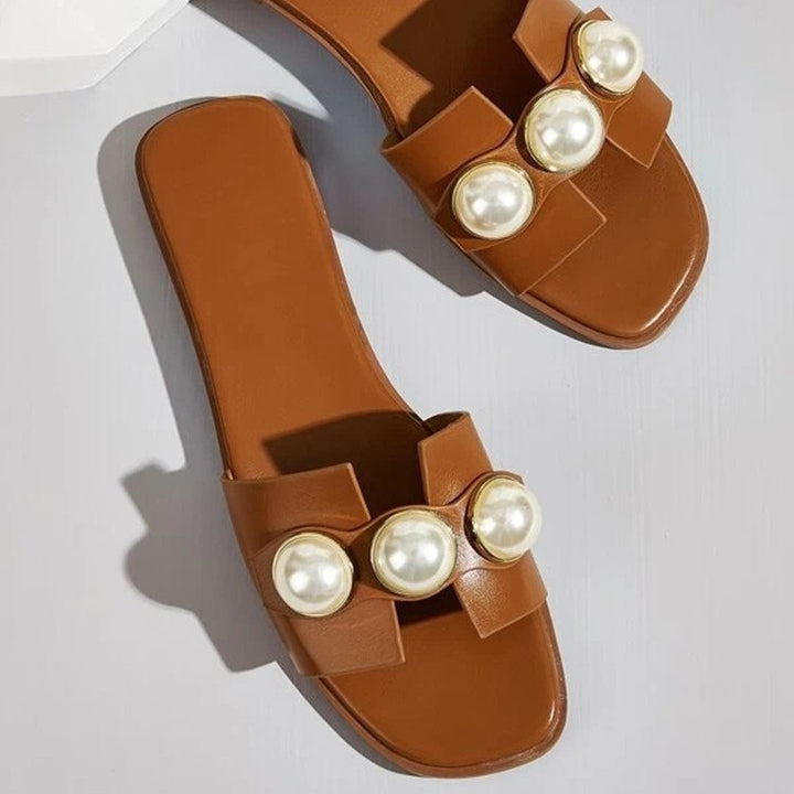 Ladies' flat slide sandal with large decorative pearls and gold-trimmed applications padded comfort footbed Mune Fashion