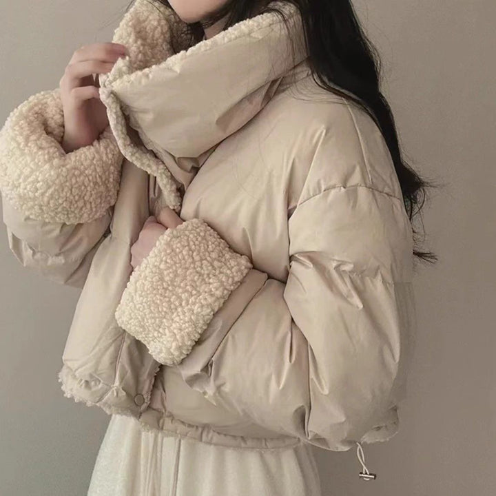Women's short quilted puffer jacket with teddy collar, roll-up sleeves, and drawstring hem Mune Fashion