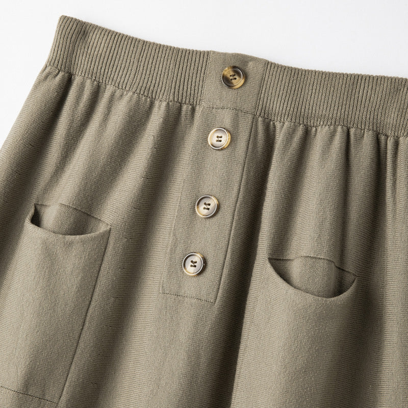 Women's midi skirt made of wool blend with A-line, elastic ribbed waistband, decorative button placket, and patch pockets Mune Fashion