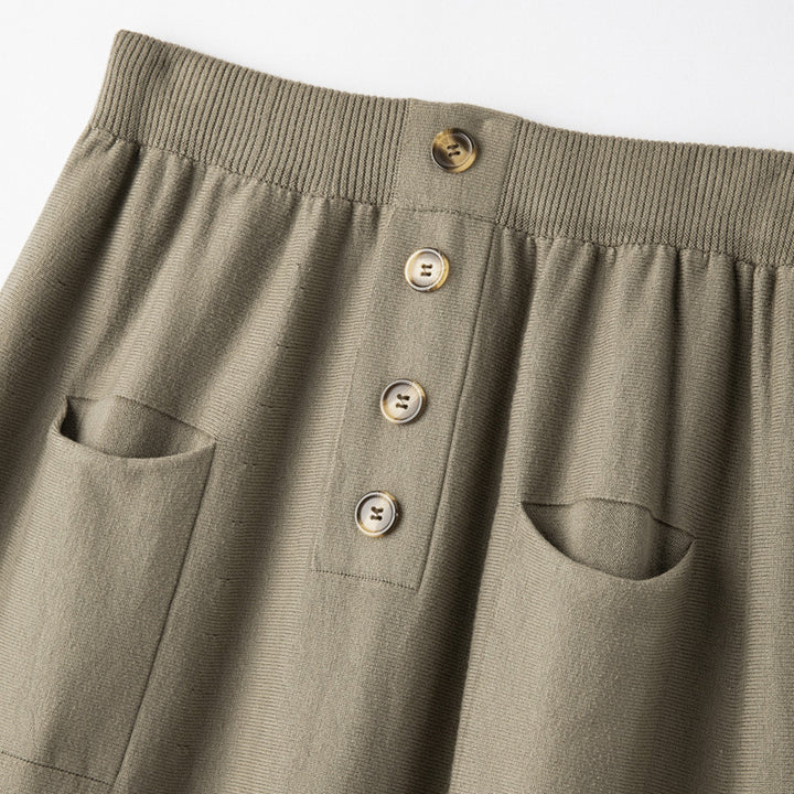 Women's midi skirt made of wool blend with A-line, elastic ribbed waistband, decorative button placket, and patch pockets Mune Fashion