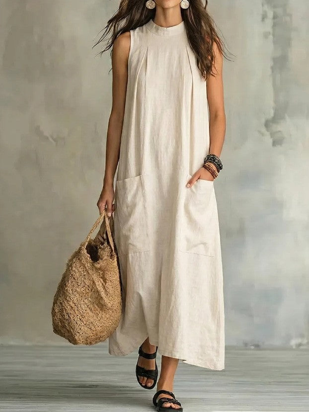 Women’s sleeveless linen maxi dress with standing collar, pleats at the chest, and piled pockets Mune Fashion