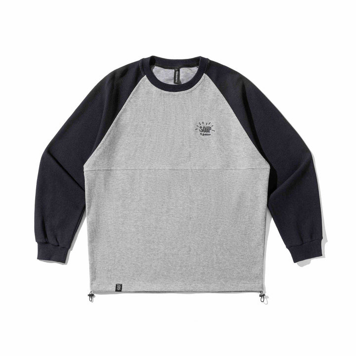 Unisex Raglan sweatshirt with thermo waffle texture, drawstring hem and subtle chest embroidery Mune Fashion