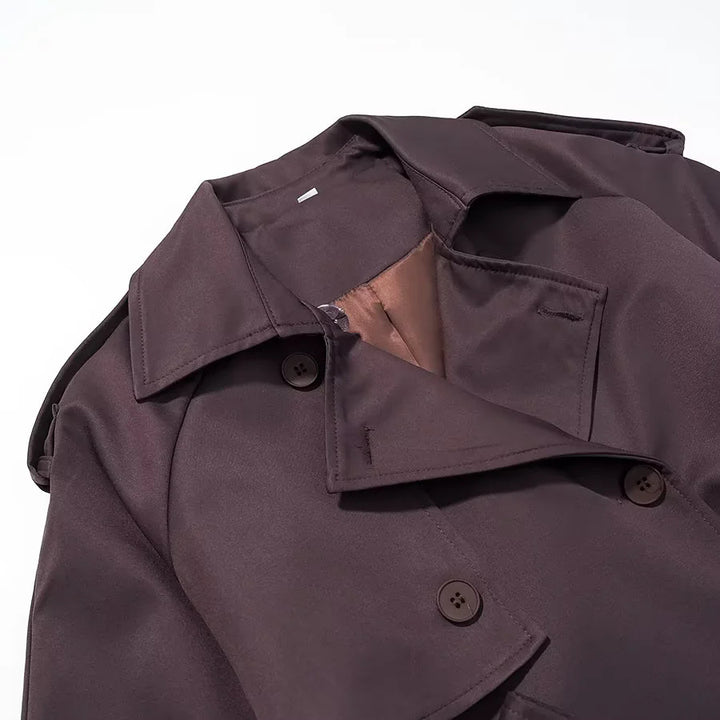 Women's longer double-breasted trench coat with waist belt, epaulettes, and storm flap Mune Fashion