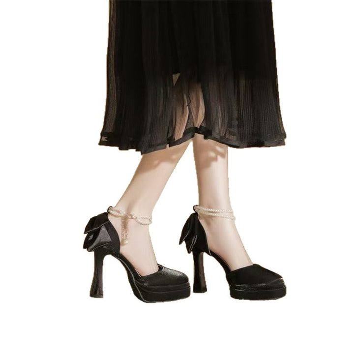 Ladies' satin platform pumps with decorative bow and adjustable ankle strap Mune Fashion