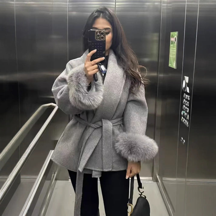 Women's fitted coat with belt tie, shawl collar and voluminous faux fur cuffs Mune Fashion