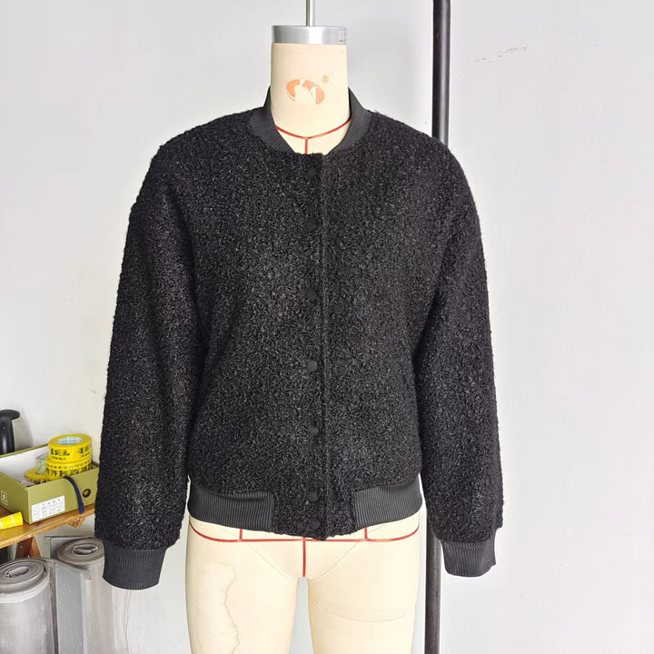 Ladies cozy teddy bomber jacket in college style with concealed snap button placket and integrated pockets Mune Fashion