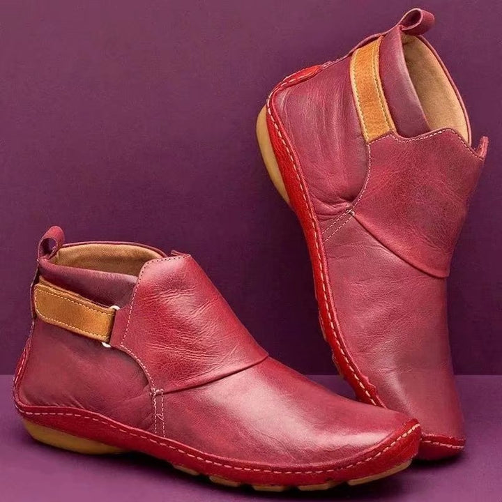 Women's ankle-high slip-on boots made of soft synthetic leather with adjustable hook-and-loop strap and hand-stitched moccasin seam Mune Fashion