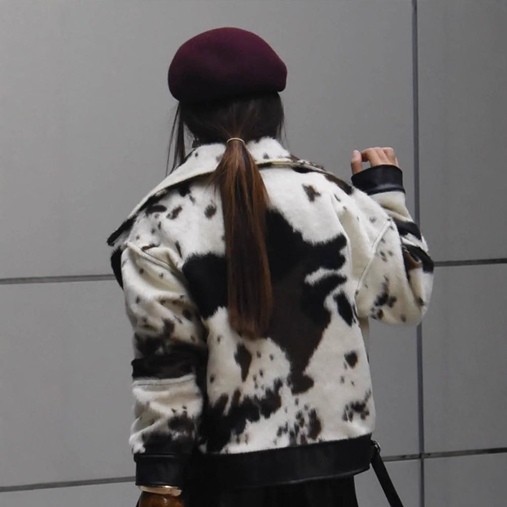 Women short padded biker jacket made of faux fur in cow print with contrast leather trim Mune Fashion
