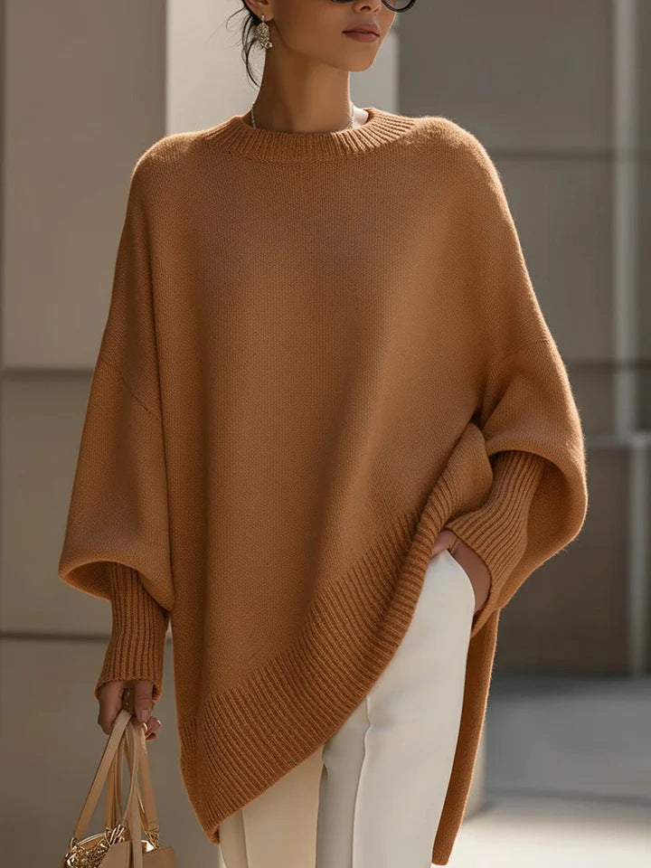 Women's oversized knit poncho with asymmetrical hem and ribbed sleeves Mune Fashion