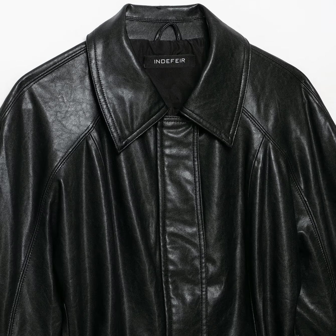 Women's short jacket made of vegan leather with a waist tie belt and dropped raglan sleeve construction Mune Fashion