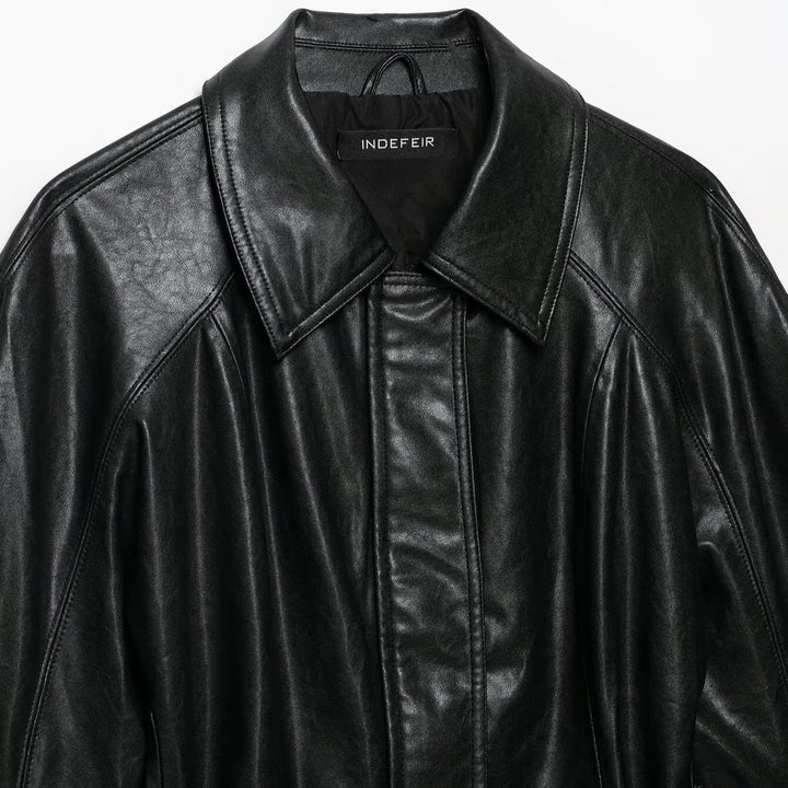 Women's short jacket made of vegan leather with a waist tie belt and dropped raglan sleeve construction Mune Fashion