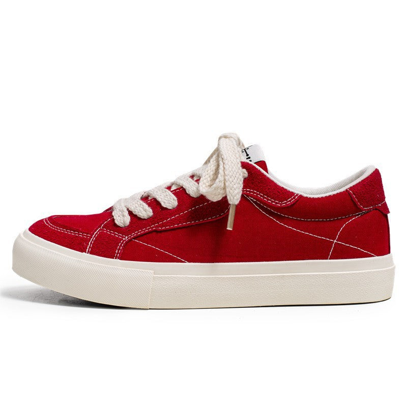 Unisex casual canvas low-top sneaker with contrasting decorative stitching and padded platform sole Mune Fashion