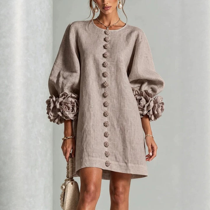 Women’s midi dress with voluminous puff sleeves, 3D flower button placket and linen texture Mune Fashion