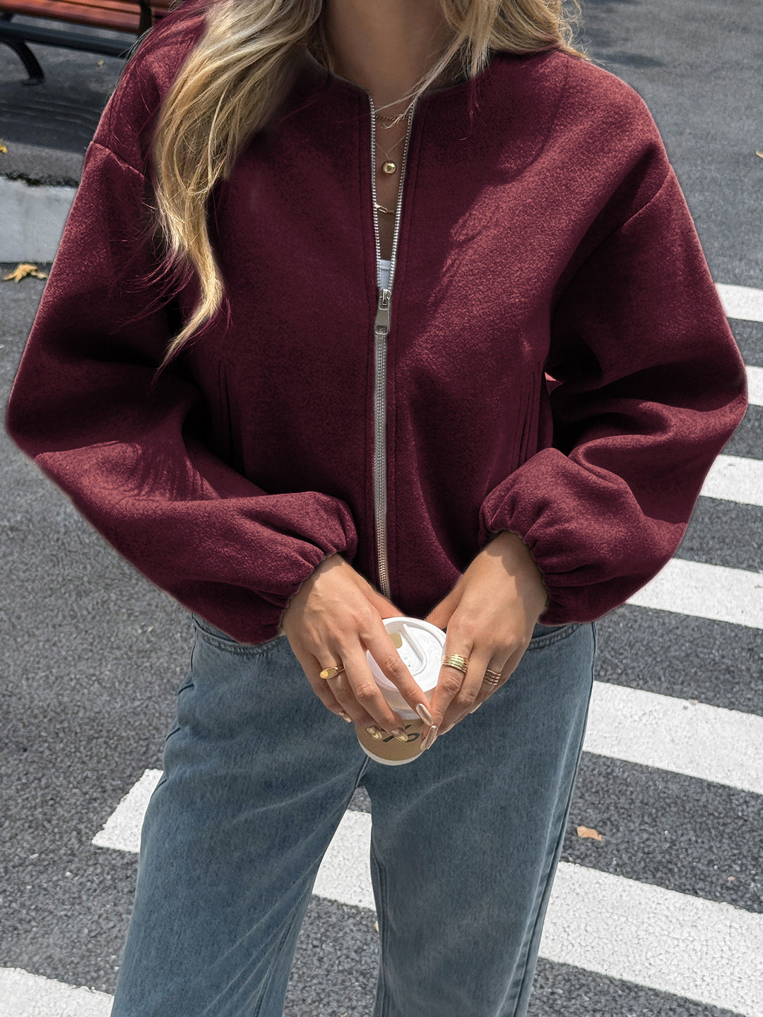 Women's short cozy bomber jacket with continuous zipper, elastic hem, and concealed pockets Mune Fashion