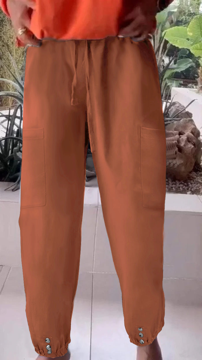 Ladies cargo jogging pants with drawstring, patch pockets and button cuffs Mune Fashion